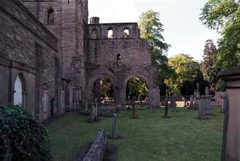 Two arches of the long aisle, from the churchyard.