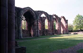 Large gothic arches line the aisle of Melrose