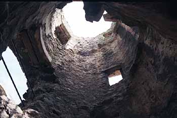 Looking up a narrow stairway tower