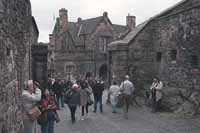 A crowded pathway through the castle entrance