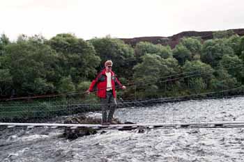 Mark holding on across the bridge